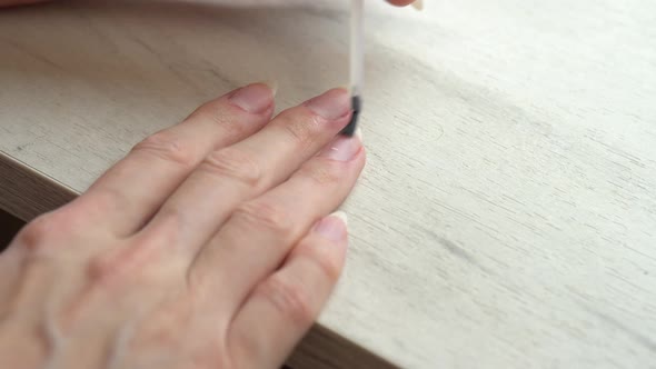 Applying a Base Coat Before Coating Nails with Nail Polish Self Manicure at Home alt