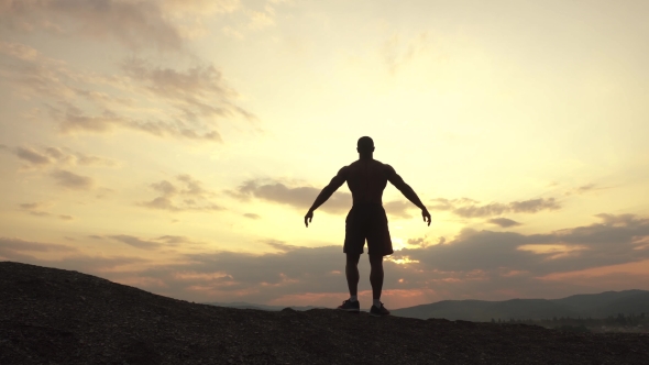 Beauty Of Human's Body. African American Bodybuilder Posing At Sunset Or Sunrise During His Outdoor