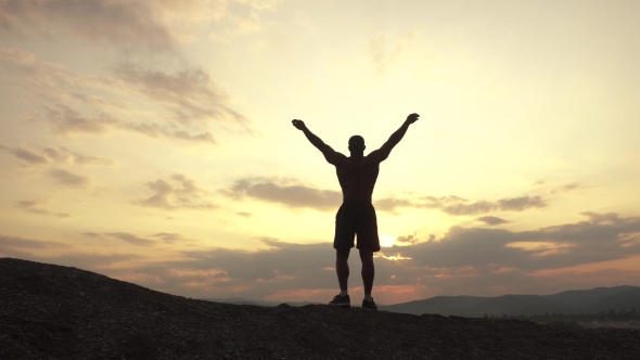 Beauty Of Human's Body. African American Bodybuilder Posing At Sunset During His Outdoor Training