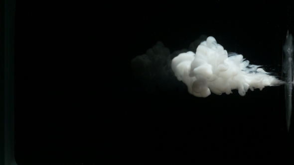 A Cloud Of White Paint On a Black Background.