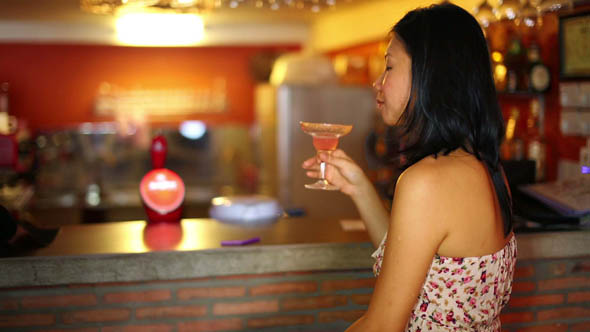 Asian Young Woman Drink Cocktail Alone at Bar