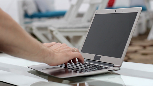 Man Working On Laptop alt