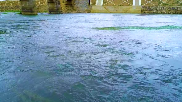 Real Shot Of River Water Through The Pier