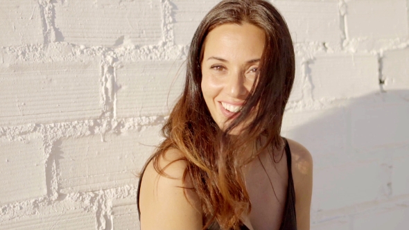 Gorgeous Young Woman With a Dreamy Smile alt