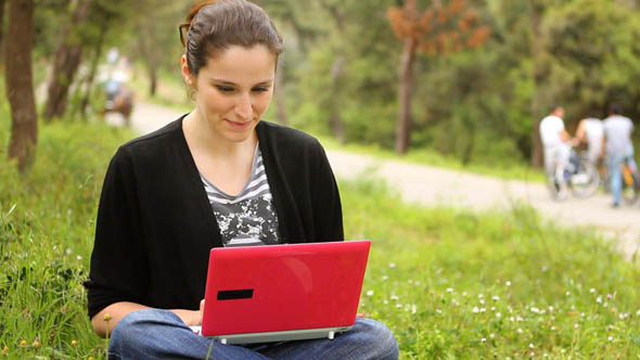 Beautiful Girl Using Computer in Countryside, Phaeton Passing Behind 2