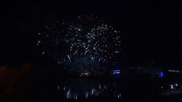Fireworks Over The River. Reflection. Panorama.