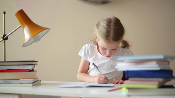 Little Schoolgirl Learns Lessons, Thoughtful Child Doing Homework alt