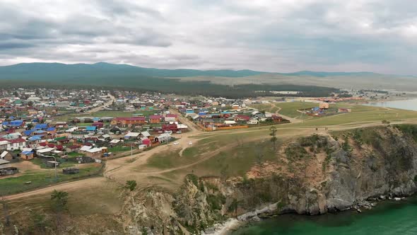 Aerial view of the rural village Khuzhir on Olkhon Island on a rocky hill of Lake Baikal, Russia