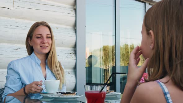 The Woman is Talking to the Girl the Woman's Speech and Smile Inspire the Girl to Talk to the Woman alt