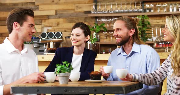 Friends having coffee in cafe alt