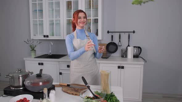 Charming Woman Decides to Cook a Healthy Salad of Fresh Vegetables and Catches a Green Salad Puts on alt