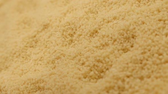 Traditional north African balls of instant Couscous  falling over pile slow motion 1080p HD video -  alt