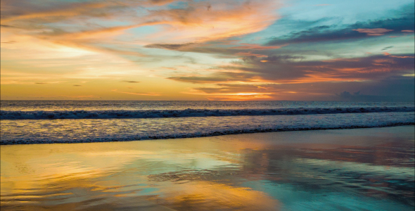 Sunset At Ocean With Reflections On Sand