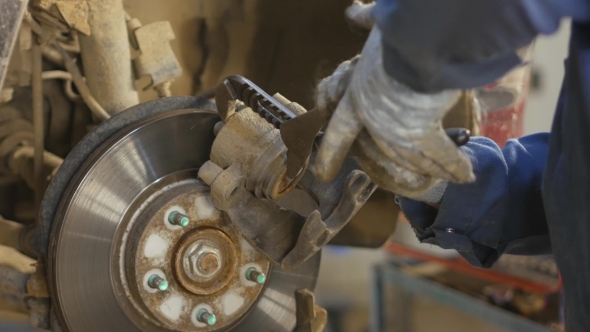 A Car Mechanic Repairing a Vehicle Break, Stock Footage | VideoHive