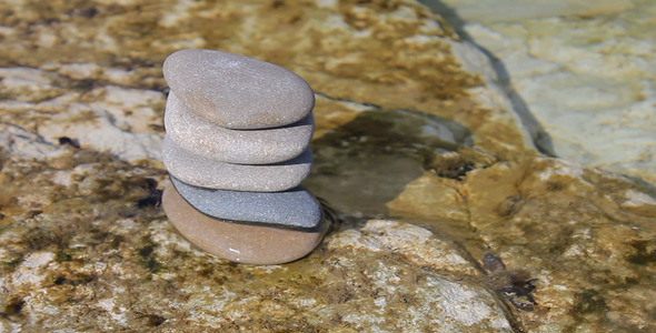 Stacked Pebbles In Sea Water
