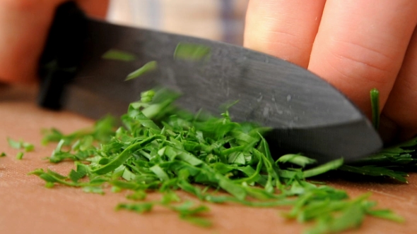 Professional Cook Is Chopping Parsley