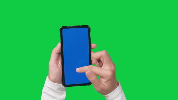 Woman hand holding and touching screen the smartphone with blue screen