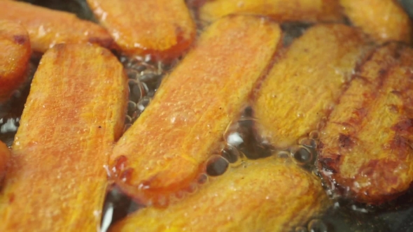 Frying Pieces Of Carrots Dolly Shot alt