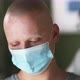 Unhappy Cancer Patient in Mask During Appointment in Clinic