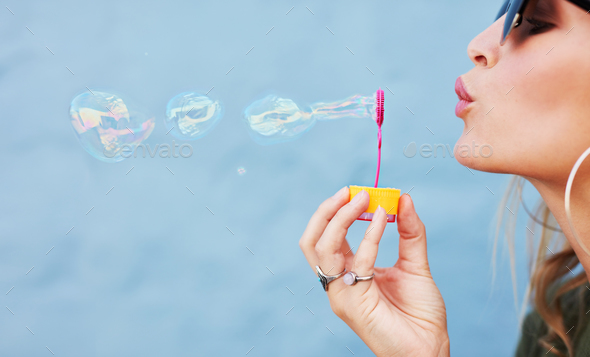 blowing soap bubbles
