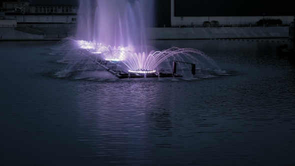 Bright Fountain On The Water Pond Or River
