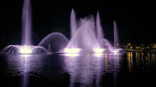 Bright Fountain On The Water Pond Or River