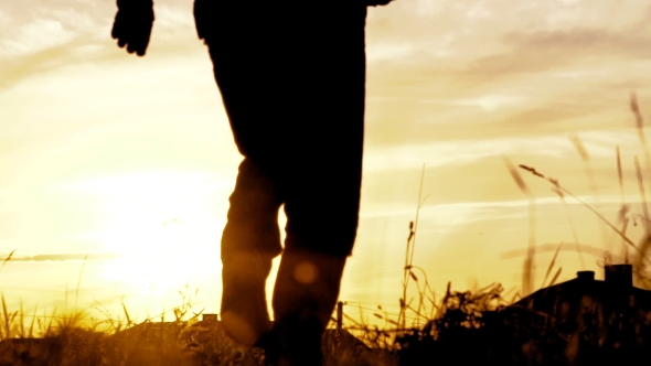 Man Steps, Practicing Parkour Jumps In The Park. Slowly alt