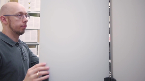 IT Engineer Open The Server Rack And Checks alt