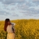 Mother Holding Her Son At Field At Sunset - VideoHive Item for Sale