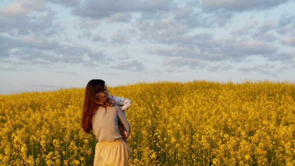 Mother Holding Her Son At Field At Sunset, Stock Footage | VideoHive