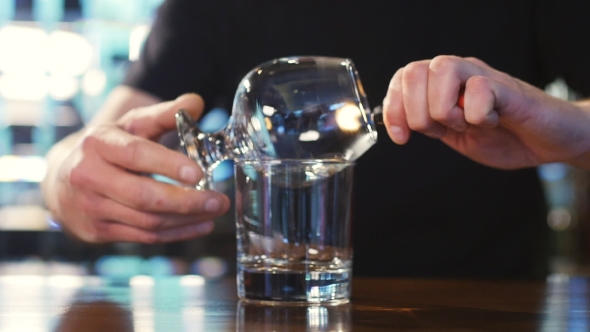 Bartender Burning Sambuca At The Bar. Spectacular Cooking Sambuca At The Bar alt