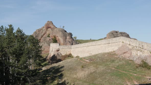 Tilting on stone formations in Western Bulgaria 4K 2160p 30fps UltraHD footage - Group of rocks abov alt