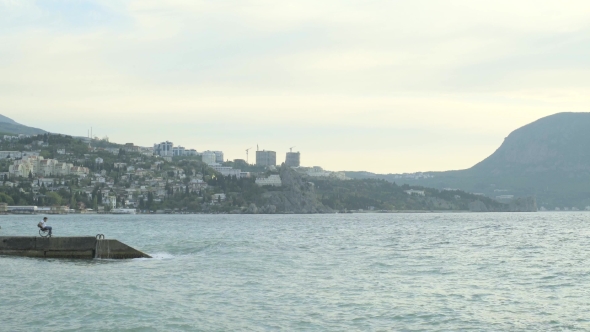 Man In A Wheelchair At The Sea