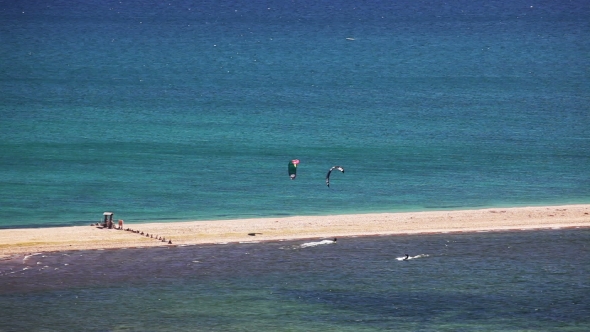 Kite Surfing On Blue Sea Surface