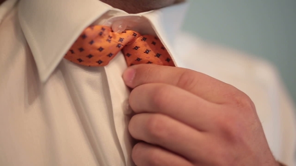 Groom Corrects a Tie 