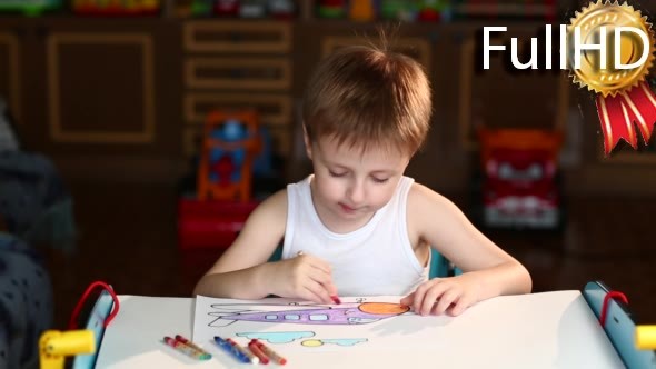 Boy Paints the Plane With Crayons Sitting at