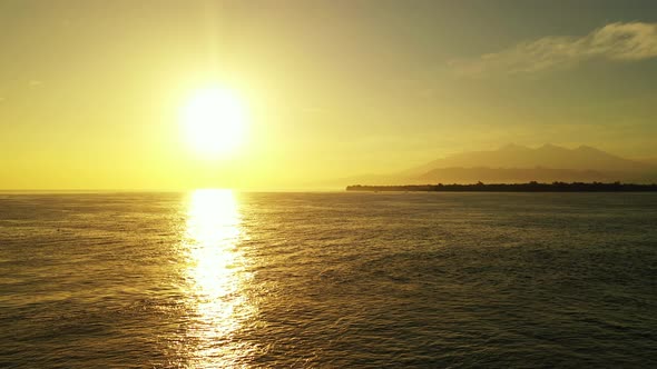 Daytime drone clean view of a white paradise beach and blue ocean background in vibrant 4K alt