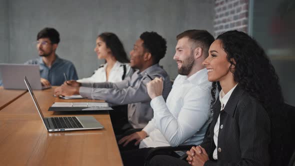 Young Multiracial Office Workers Watching Presentation Employees Smiling Nod Approvingly Listening alt