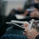  Of Hands Holding Pens And Making Notes At The Conference - VideoHive Item for Sale