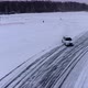 Aerial view of the rally car on a snowy road - VideoHive Item for Sale