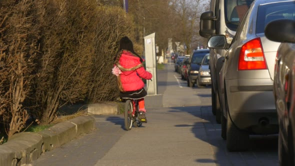 Little Girl is Riding the Bike Awkwardly City alt