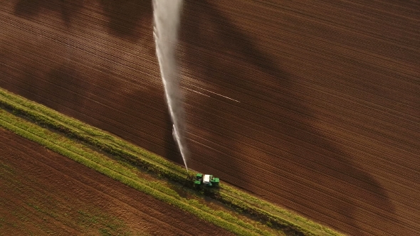 Aerial view:Irrigation System Watering a Farm Field alt