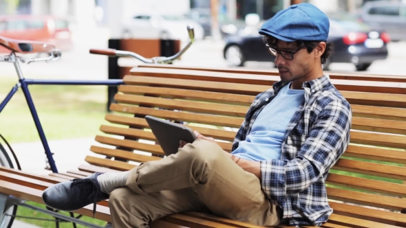 Man With Tablet Pc Sitting On City Street Bench 28 alt