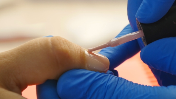 Applying Nail Polish On Nails With a Brush