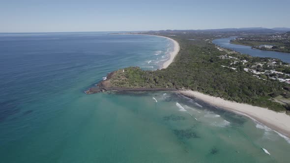 Aerial View Of Fingal Head Lighthouse Built On Forested Headland Overlooking Tasman Sea In New South alt