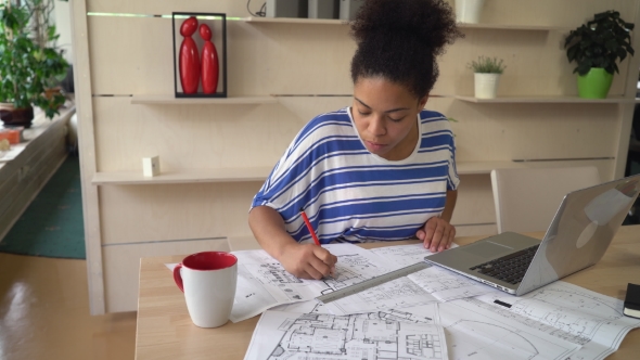 Woman Successful Architect Correct Design On Blueprint In The Office. alt