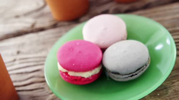 Colorful macaroon cookies in plate alt