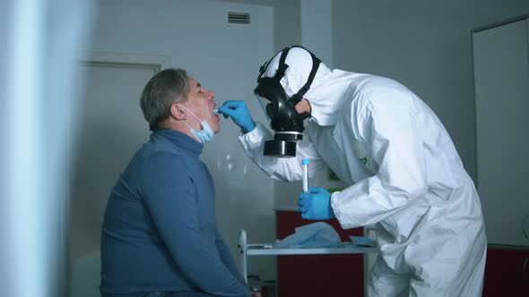 Medical Worker Is Taking Patient's Biological Sample for a Test. Sick Coronavirus Patient in a alt