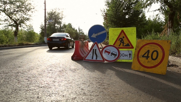 Traffic Signs Installed in the Pile, During Road Repair alt