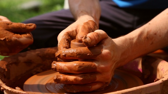 Potter Makes Pottery Clay on a Potter's Wheel alt
